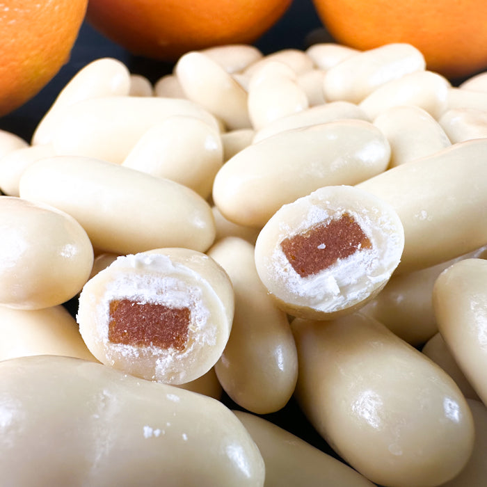 Dražejas ar apelsīnu cukātiem baltā beļģu šokolādē