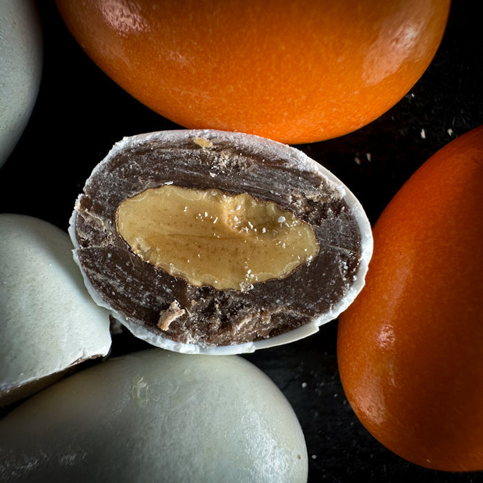 Mandeles piena šokolādē ar cukura-apelsīnu glazūru